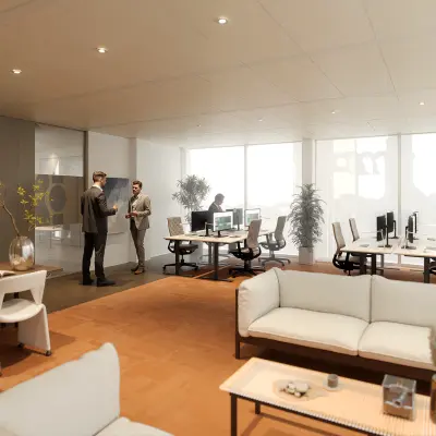 Modern office space at Claude Debussylaan 80-134 in Amsterdam Zuidas with people engaging in meetings and working at desks. Ideal for office space rental.