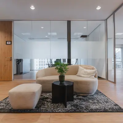 Furnished office interior at De Boelelaan 30, Amsterdam Zuidas, featuring modern seating and table. Ideal for office space rental.