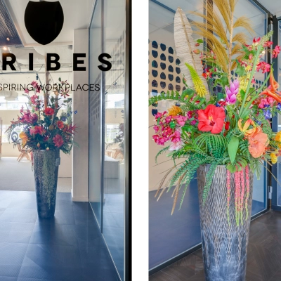 Colorful floral arrangement in the entrance of an office space at Gustav Mahlerlaan 308, Amsterdam Zuidas, ideal for office space rental.