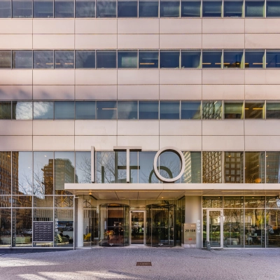 Exterior view of office building at Gustav Mahlerplein 28 & 58-60 in Amsterdam Zuidas, showcasing large glass windows and a modern facade.