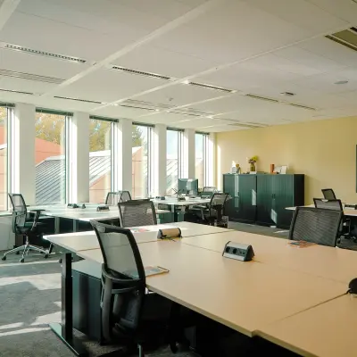 Bright office space to rent at Jachthavenweg 109, Amsterdam Zuidas, featuring large desks and ergonomic chairs ideal for workspace rental.