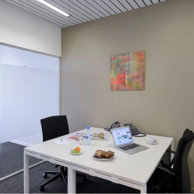 Modern furnished office for rent at Lange Lozanastraat 142, Antwerp Center, featuring a bright workspace with chairs and a desk, ideal for professionals looking for office space rental.