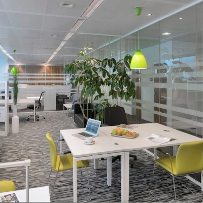Bright office space on Lange Lozanastraat 142, Antwerp Center with modern furniture, green accents, and ample natural light. Available for rent office space.