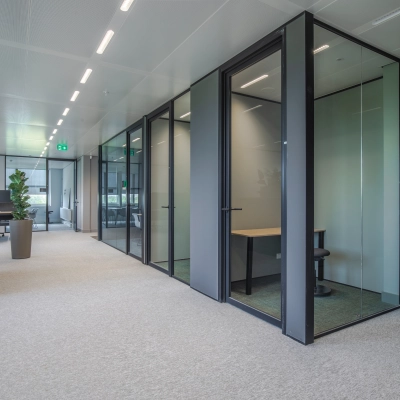 Modern office to rent at Rijksweg-West 2, Arnhem Zuid, featuring sleek glass-walled cubicles and minimal decor ideal for flexible office space rental.