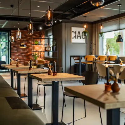 Modern office space with contemporary decor, featuring tables and chairs for versatile workspace. Ideal for office space rental at Baron van Nagellstraat 136, Barneveld.