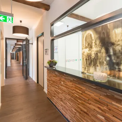 Furnished office reception area at Blokstallen 2B, Bergen op Zoom, ideal for office space rental with warm lighting and wooden accents.