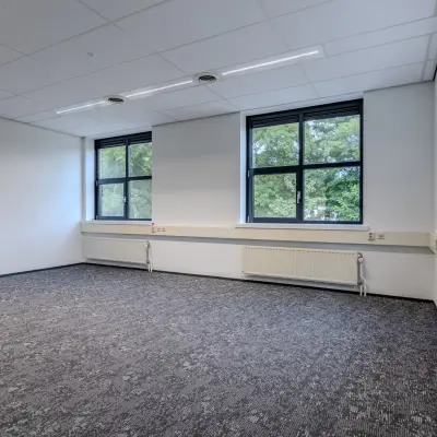 Spacious, well-lit office space with large windows at Rijtuigweg 10 for rent in Bergen op Zoom.