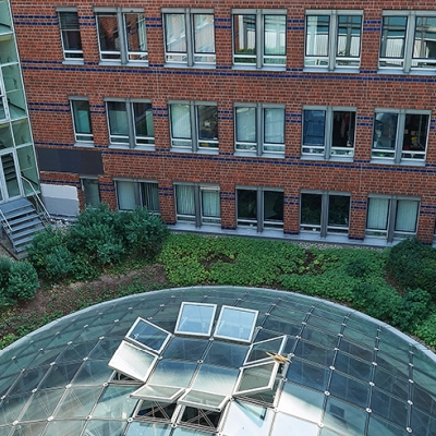 Exterior view of Koppenstraße 93 in Berlin Friedrichshain, showcasing a modern office building available for rent.