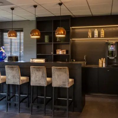 Furnished office space with a modern bar setup at Takkebijster 57A, Breda Oost-Brabantpark, available for rent.