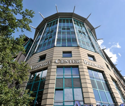 Exterior view of a modern office building at Flughafenallee 26, Bremen Neustadt, ideal for office space rental.