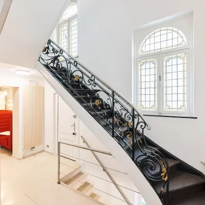 Elegant office staircase with decorative railing located at Rue du Congres 37 in Brussels Center, ideal for office space rental.