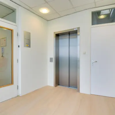 Elevator area inside office space at Regulierenring 2, Bunnik, available for rent.