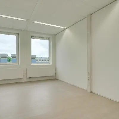 Unfurnished office space with large windows at Regulierenring 2, Bunnik, ideal for rent office space.