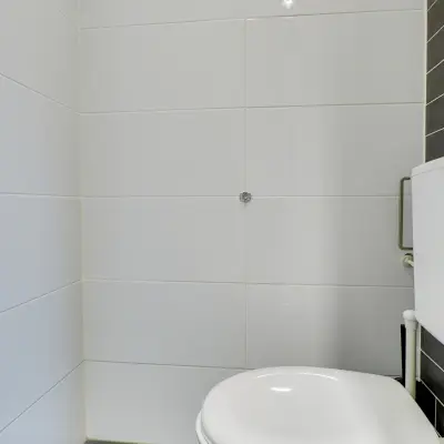 Simple restroom in an office space at Regulierenring 2, Bunnik available for rent.