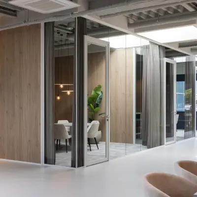 Modern office space at Essebaan 63, Capelle aan den IJssel, featuring glass partitions, sleek lighting, and contemporary furniture. Perfect for a professional environment and office space rental opportunities.