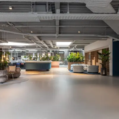 Modern furnished office space with seating areas and ample lighting at Essebaan 63 in Capelle aan den IJssel, ideal for office space rental.