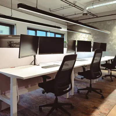 Modern office space at Rivium Quadrant 75, Capelle aan den IJssel, featuring multiple workstations with computers and ergonomic chairs ideal for office space rental.