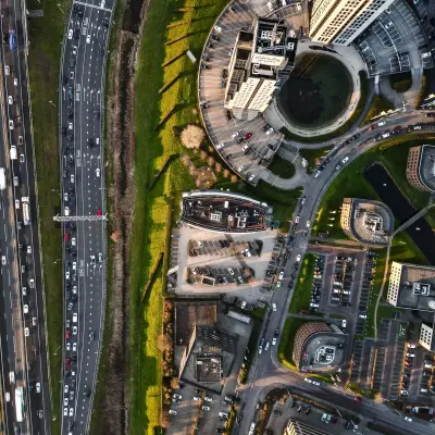 Aerial view of Rivium Quadrant 75 in Capelle aan den IJssel, showcasing office buildings and parking areas.