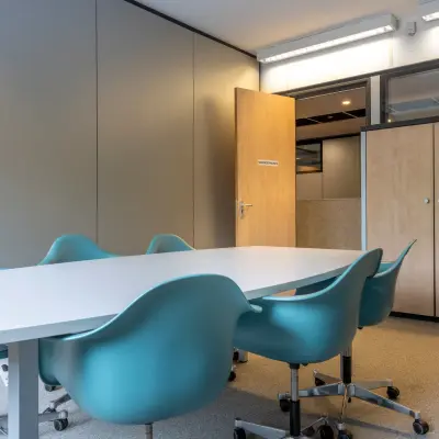Furnished office space at Delftechpark 9, Delft, featuring a meeting table with chairs, ideal for those looking to rent office space.