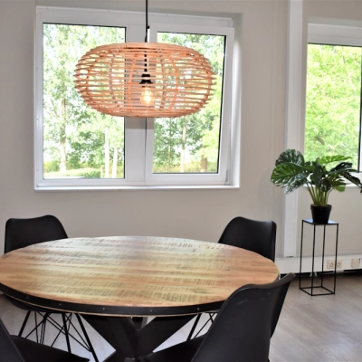 Bright, furnished office space with a round wooden table and modern chairs, ideal for office space rental at Keulenstraat 10, Deventer.