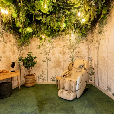 Stylish office space rental featuring a comfortable lounge chair with a nature-themed interior at Diemerhof 42, Diemen.