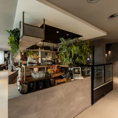 Modern furnished office space with greenery at Diemerhof 42, Diemen, ideal for rent office space seekers.