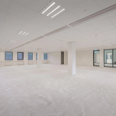 Spacious office space for rent at Wisselwerking 40-48, Diemen, featuring open floorplan with large windows and neutral decor, ideal for flexible office space rental.