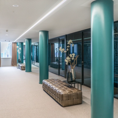 A sleek hallway in Dreischeibenhaus, Düsseldorf, ideal for office space rental with stylish decor and modern glass accents.