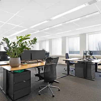 Bright office space at Celsiusstraat 34, Ede, featuring modern desks, ergonomic chairs, and large windows, ideal for those looking to rent office space.