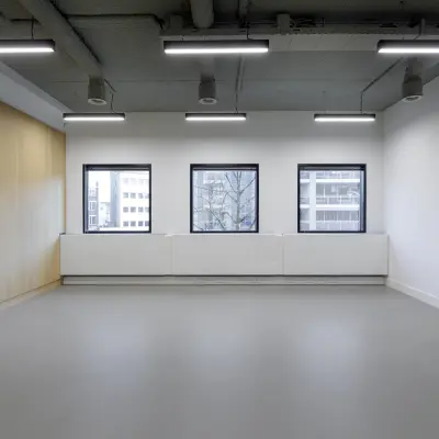 Spacious office to rent in Eindhoven Center with large windows and modern lighting, ideal for office space rental.