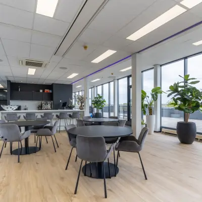 Bright, stylish office space rental at Meerenakkerplein 1-10, Eindhoven De Hurk, featuring modern furniture and large windows for natural light.