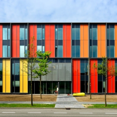 Colorful exterior of the office building at High Tech Campus 10, Eindhoven, with vibrant panels and modern architecture, ideal for advanced companies seeking office space rental in a high-tech environment.