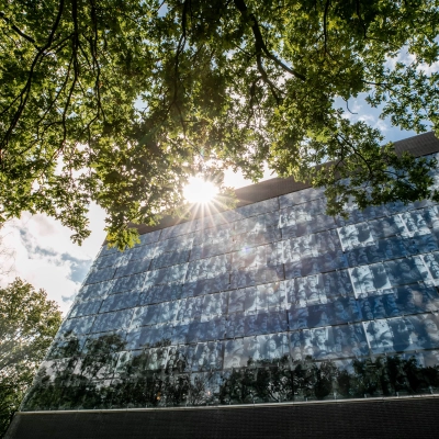 Exterior view of office building at TU campus, De Zaale 11, Eindhoven High Tech Campus, surrounded by trees under a sunny sky. Ideal for those seeking office space rental.