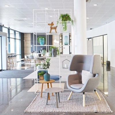 Modern office space rental at Anderlechtstraat 15, Eindhoven North, featuring a sleek lobby with stylish seating and decor.