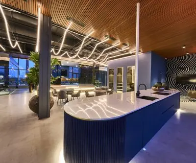 Modern office interior at Achtseweg Zuid 159R, Eindhoven Strijp-S, featuring stylish lighting and seating, perfect for office space rental.