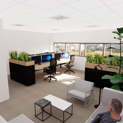 Modern office interior at Brandweerstraat 20-30, Enschede featuring open workspaces with desks, chairs, plants, and large windows offering natural light. Ideal for anyone looking for office space rental.