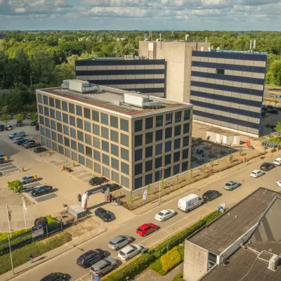 Aerial view of the office buildings at Moutlaan 1-23, Enschede, showcasing available office space rental options.