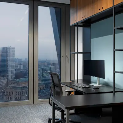 Modern office space rental at Junghofstraße 9, Frankfurt Center with large windows offering city views. Ideal office to rent with a sleek desk and chair setup.