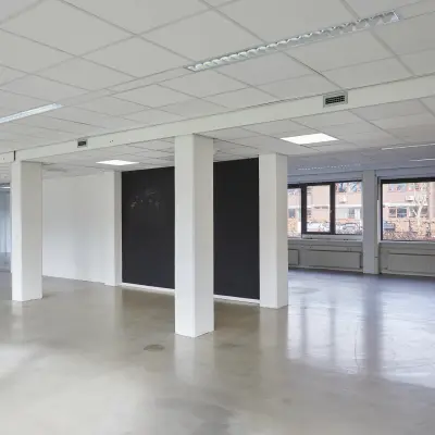 Spacious and unfurnished office space available for rent at Schweitzerlaan 12, Groningen. Features open floor plan with ample natural light, ideal for custom office space rental setup.