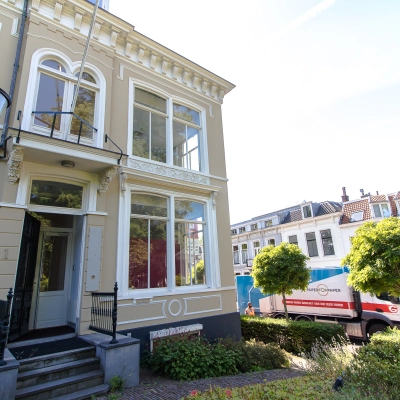 Exterior view of an office building at Prinsen Bolwerk 1, Haarlem Centraal Station with large windows and classic architecture.