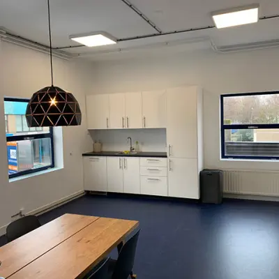 Bright office space with modern furnishings and a kitchenette, perfect for office space rental at Nijverheidsweg 50, Haarlem Oost.