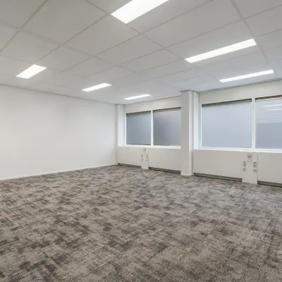 Spacious, carpeted office space with large windows in Haarlem Waarderpolder, ideal for rent office space needs.