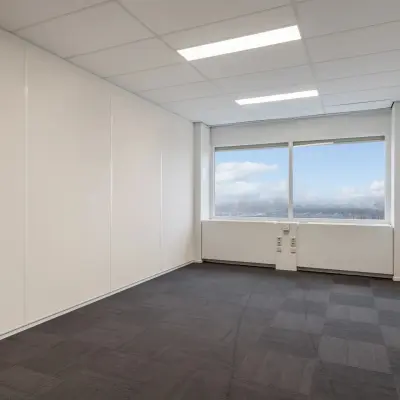Empty office space with large windows at A. Hofmanweg 5A in Haarlem Waarderpolder, available for rent. Ideal for customizing your workspace.