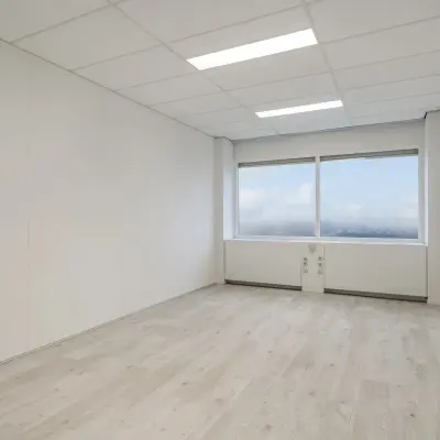 Bright unfurnished office space available for rent at A. Hofmanweg 5A in Haarlem Waarderpolder, featuring wide windows and modern lighting.