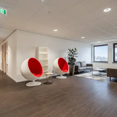 Spacious and modern office space for rent at Mollerusweg 84 in Haarlem Waarderpolder, featuring stylish seating and large windows allowing natural light.