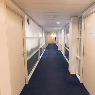 Bright hallway in an office building at Franciscusweg 219, Hilversum, showcasing potential for office space rental.