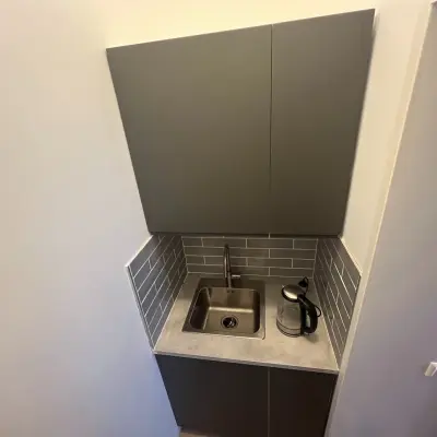 Compact kitchenette area in office space at Oude Enghweg 8, Hilversum, ideal for quick breaks in a rented office environment.