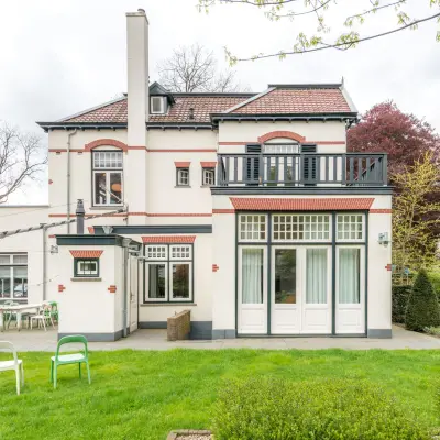 Charming exterior view of a traditional-style office building for rent in Hilversum, suitable for office space rental.