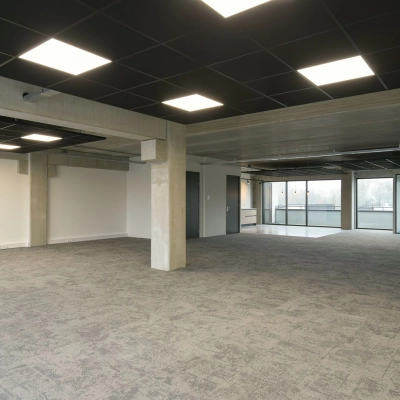 Spacious office to rent at Zuiderloswal 55, Hilversum, featuring large windows and modern lighting, ideal for office space rental.