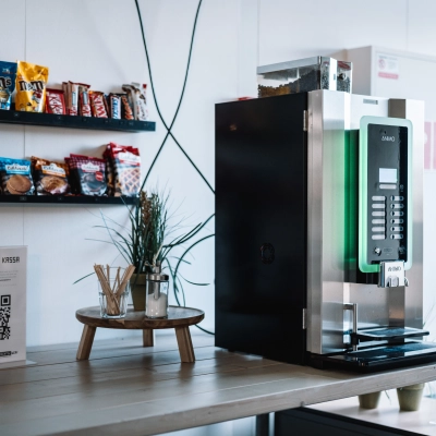 Furnished office pantry at De Vos van Steenwijklaan 75, Hoogeveen, offering self-service coffee and snacks, ideal for office space rental.